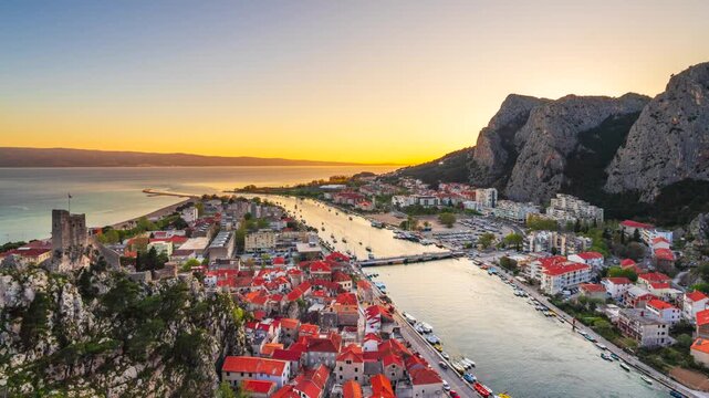 Omis, Croatia skyline with the karst mountains at dusk.
