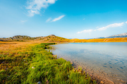 Deep blue waters of Vrazje Jezero (Devil's Lake) on the high plateau of Durmitor National Park, scenic mountain lake landscape in Montenegro.