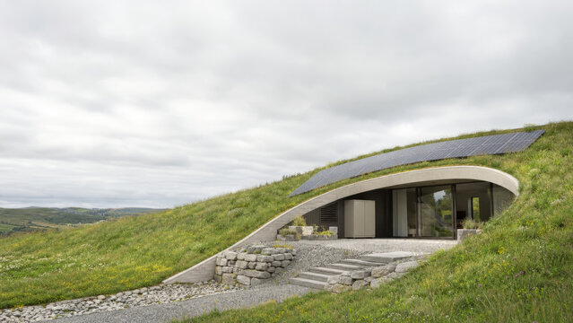 Earth Sheltered Energy Positive Home Integrated into Green Hillside with Copy Space