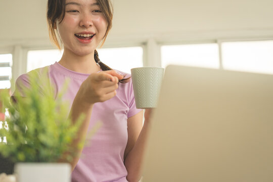 Young Asian Woman Working Online, Relaxing and Practicing Self Care During Daily Life at Home