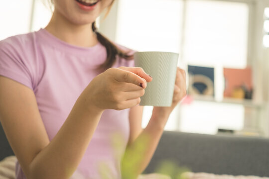 Young Asian Woman Working Online, Relaxing and Practicing Self Care During Daily Life at Home