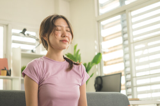 Young Asian Woman Working Online, Relaxing and Practicing Self Care During Daily Life at Home