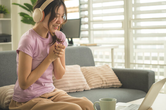 Young Asian Woman Working Online, Relaxing and Practicing Self Care During Daily Life at Home