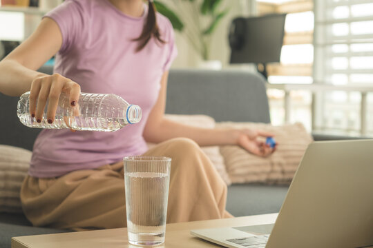 Young Asian Woman Working Online, Relaxing and Practicing Self Care During Daily Life at Home