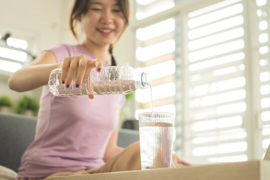 Young Asian Woman Working Online, Relaxing and Practicing Self Care During Daily Life at Home