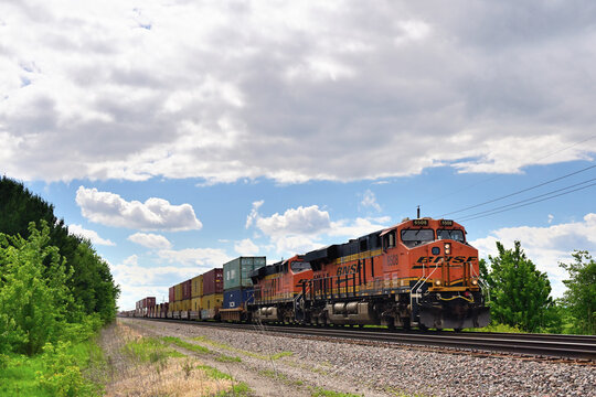 Two Burlington Northern Santa Fe locomotives lead an eastbound intermodal freight train through a rural section of north central Illinois.