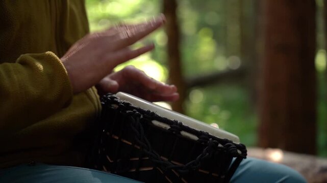 Enjoying rhythmic drumming in the forest while connected to nature and creativity at a peaceful retreat
