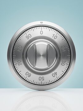 A close-up view of a brushed silver safe dial with numbers, symbolizing security, protection, confidentiality, and financial safety in business.