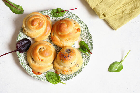 Hearty filled brioches with olives and provolone