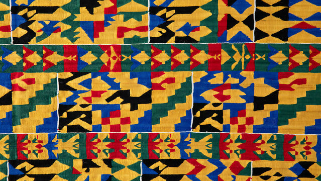 Traditional kente inspired colorful geometric pattern fabric textile design with geometric cultural colorful background ornamental composition