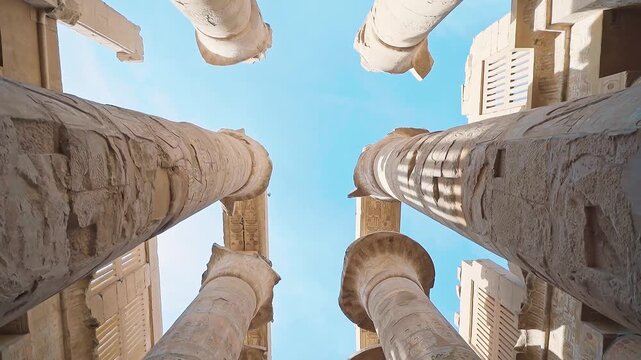 Pillars of the majestic temple of Karnak in Luxor, Egypt. Karnak Temple is dedicated to the temple complex of Ancient Egypt in honor of the god Amun-Ra, his wife Mut and son Khons. Thebes, Karnak.