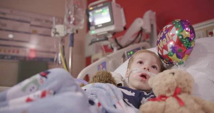 Toddler with RSV Monitored in Hospital Bed