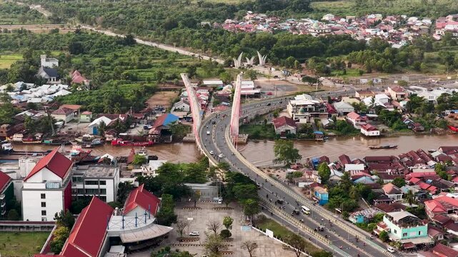 A view of Banjarmasin city and the Alalak River Bridge (or Basit Handil Bakti Bridge) in the late afternoon