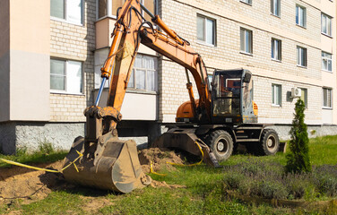 Heavy Earthmoving Digger Machine Working on Pipeline Excavation Trench Site © yaviki