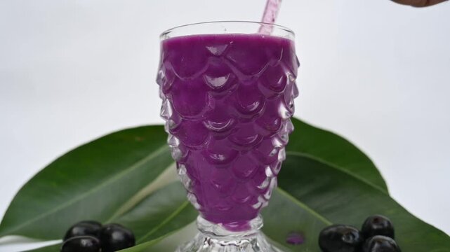 Syzygium cumini fruits juice. Its other names is Malabar plum, Java plum, black plum, jamun and jambolan. This fruit has anti diabetic properties. Indian jamun juice. Healthy drink. Fruit juice. 