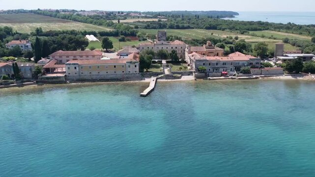 Aerial drone view of the historic abandoned Dajla monastery complex situated along the scenic Adriatic coast in Istria, Croatia.
