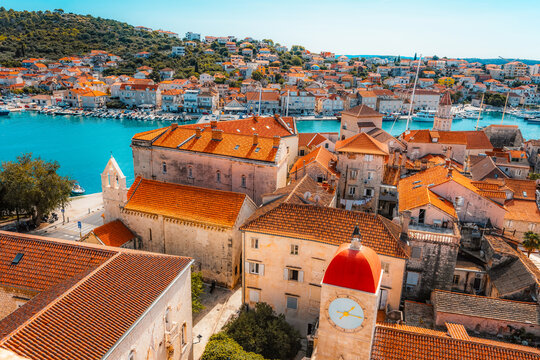 panoramic view over the historic red roofs of Trogir old town and the Adriatic sea from the bell tower of St. Lawrence Cathedral, Croatia.