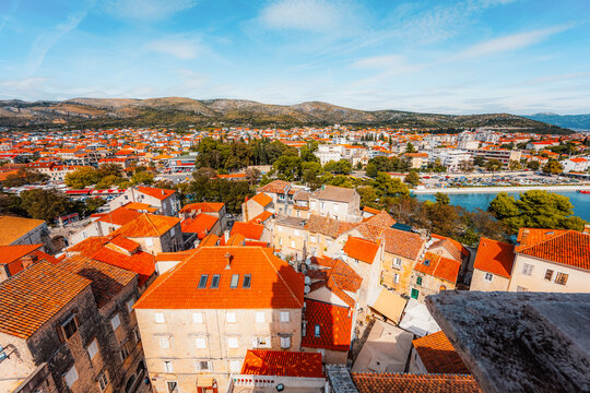 panoramic view over the historic red roofs of Trogir old town and the Adriatic sea from the bell tower of St. Lawrence Cathedral, Croatia.