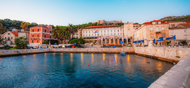 The grand St. Stephen's Square in Hvar town,  the Cathedral, the historic Arsenal, and elegant Venetian-style stone architecture, Croatia.