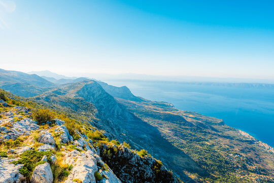 Panoramic view from Skywalk Biokovo glass platform overlooking Makarska Riviera, Adriatic sea and islands, Biokovo Nature Park, Croatia.
