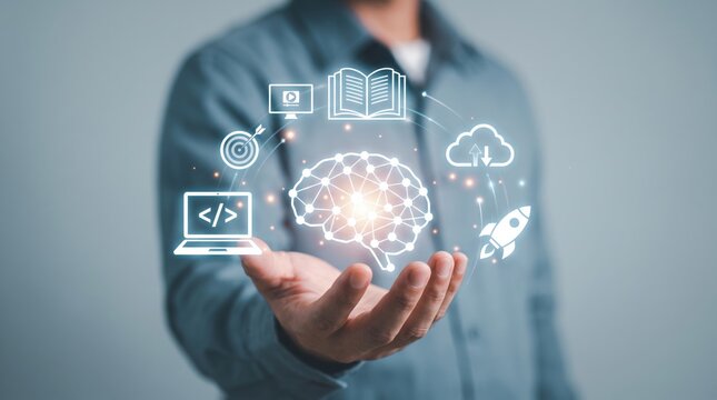 Artificial intelligence concept showing digital brain and technology icons like coding, cloud computing, rocket launch, book learning held in hand by man.