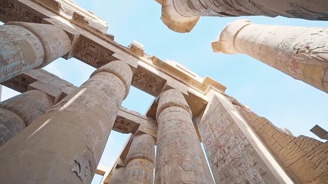 Pillars of the majestic temple of Karnak in Luxor, Egypt. Karnak Temple is dedicated to the temple complex of Ancient Egypt in honor of the god Amun-Ra, his wife Mut and son Khons. Thebes, Karnak.
