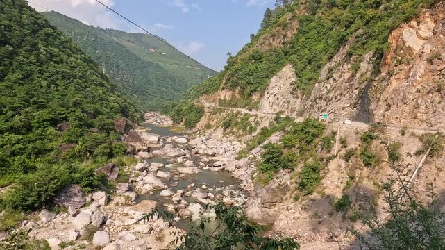 Vehicles Driving Towards Almora On Rocky Cliffside Highway Along Kosi River Valley