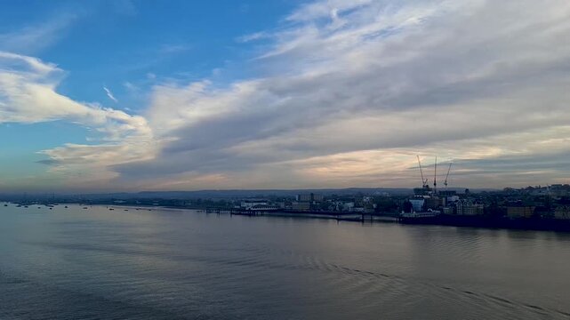 united kingdom Tilbury jan 10 2025 Tilbury Terminal Waterfront Skyline at Dusk With Cranes, Cloudy Sky and River Reflections in the UK