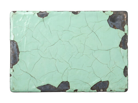 A rectangular metal plate with cracked mint green enamel paint revealing dark oxidized rust along the textured distressed edges