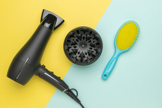 Modern Hair Dryer and Brush on Colorful Background for Stylish Home Hair Care