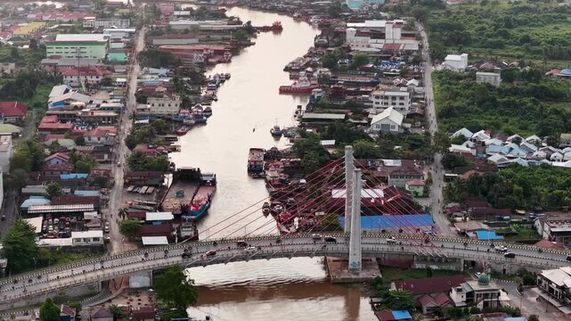 A view of Banjarmasin city and the Alalak River Bridge (or Basit Handil Bakti Bridge) in the late afternoon