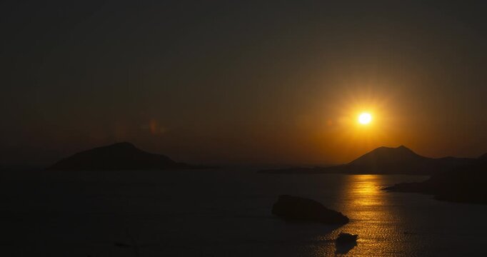 Sun setting over the Aegean Sea in Athens, Greece