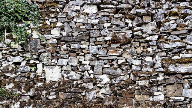 Texture of traditional dry stone masonry wal