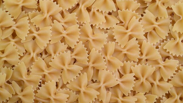 Raw pasta farfalle close-up, top view