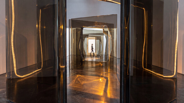 Reflective 3D glass maze rendered with golden floor reflections