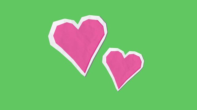Animated pink paper cut hearts fluttering loop animation green screen