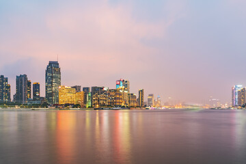 Naklejka premium Modern urban architecture, road traffic, and Huangpu River night view in Lujiazui, Pudong, Shanghai, China