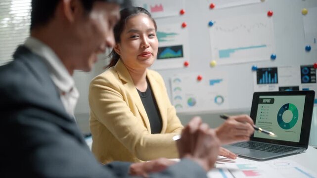 Business Team Discussing Analytics Report in Office Meeting