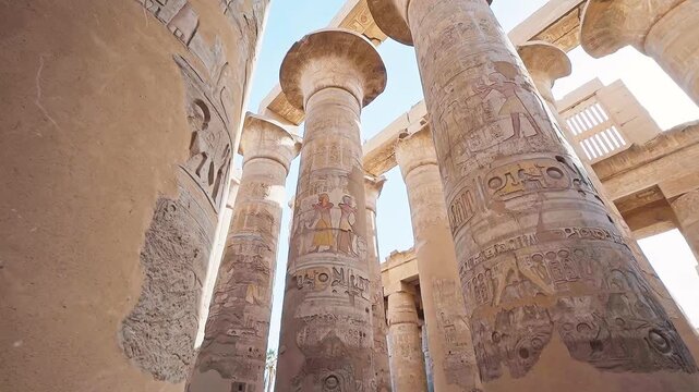 Pillars of the majestic temple of Karnak in Luxor, Egypt. Karnak Temple is dedicated to the temple complex of Ancient Egypt in honor of the god Amun-Ra, his wife Mut and son Khons. Thebes, Karnak.