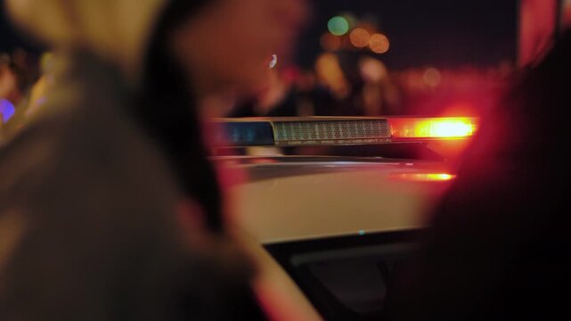 Police patrol car flashing blue emergency lights at night for law enforcement