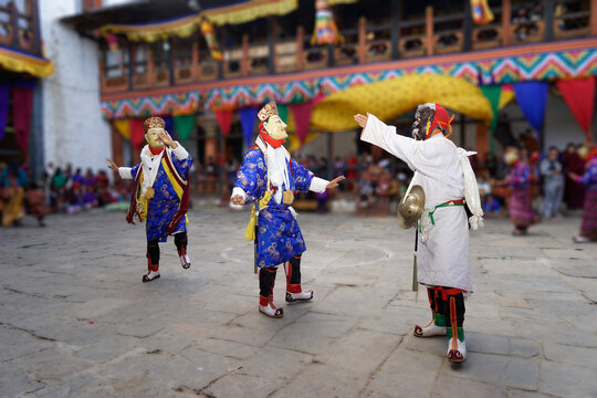Bumthang in Bhutan at the yearly festival in the monastery of Jakar. A monk is wearing a colourful traditional mask.	