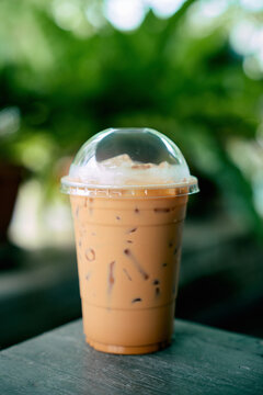 thai iced tea in plastic takeaway cup