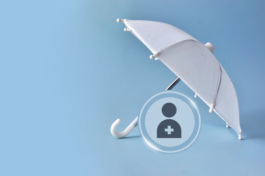 White umbrella protecting person symbol. Life and health insurance concept
