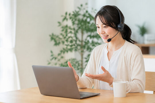 Remote care support coordinator using laptop at home