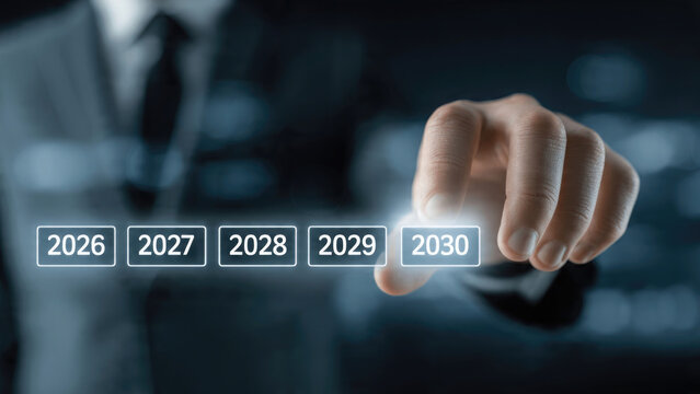 Hand touching futuristic interface with years 2026 to 2030 displayed on glowing buttons