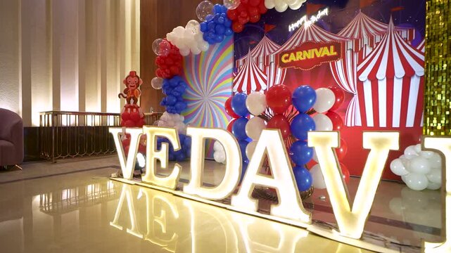 Illuminated VEDA name sign for a carnival themed birthday party decoration in India