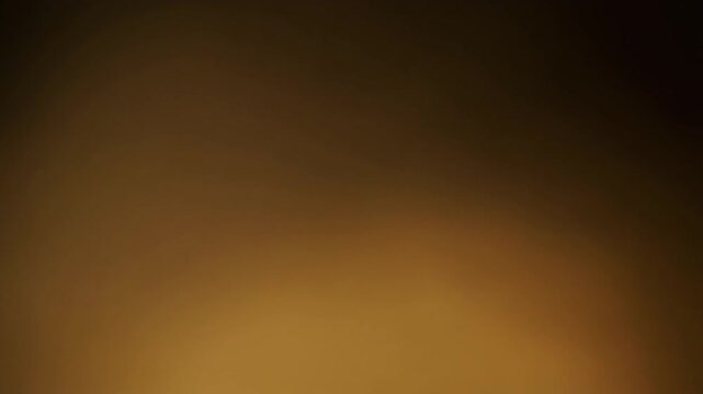 Warm honey-gold gradient light shifts and blends gradually across deep black, creating soft ambient glow, calming cinematic atmosphere, smooth color transitions, and elegant abstract motion.