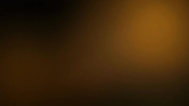 Warm honey-gold gradient light shifting across black