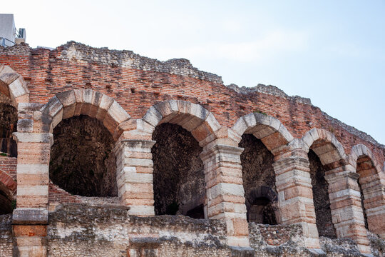 Ancient Verona Arena Roman Amphitheater Exterior Brick Wall with Arches Verona Italy.
