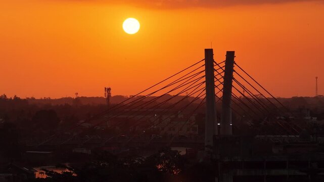 A view of Banjarmasin city and the Alalak River Bridge (or Basit Handil Bakti Bridge) in the sunset